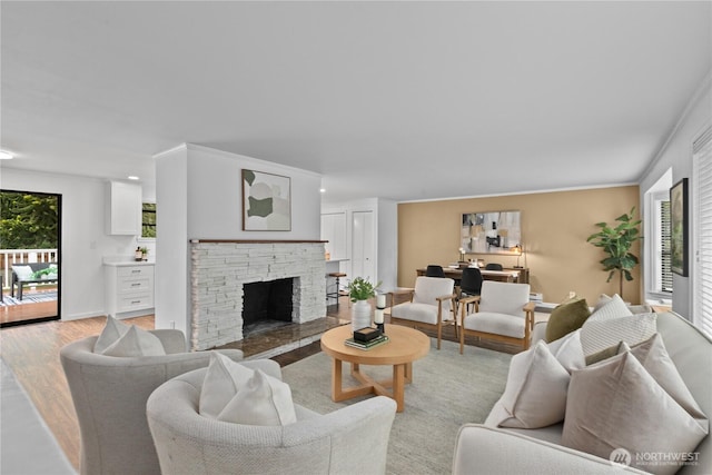 7411 201st St SW, Lynnwood, WA 98036 - living room featuring plenty of natural light, light wood-style flooring, a fireplace, and recessed lighting