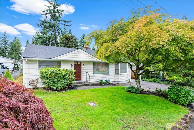 7411 201st St SW, Lynnwood, WA 98036 - view of front of home with a front yard, roof with shingles, and a chimney