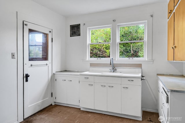 3108 S Walden St, Seattle, WA 98144 - kitchen with light countertops and white cabinetry