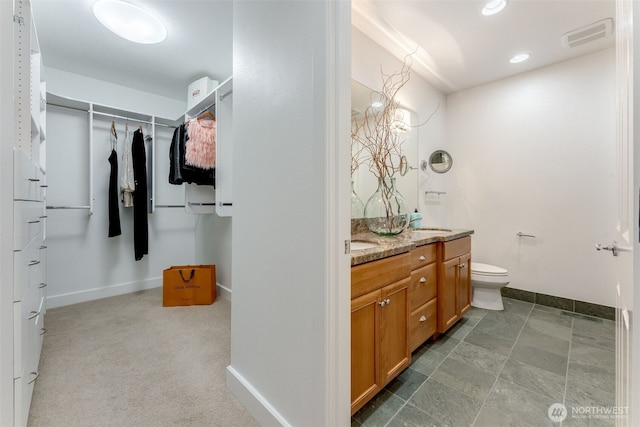 2015 SE Columbia River Dr Unit 320, Vancouver, WA 98661 - full bathroom with vanity, a walk in closet, and recessed lighting