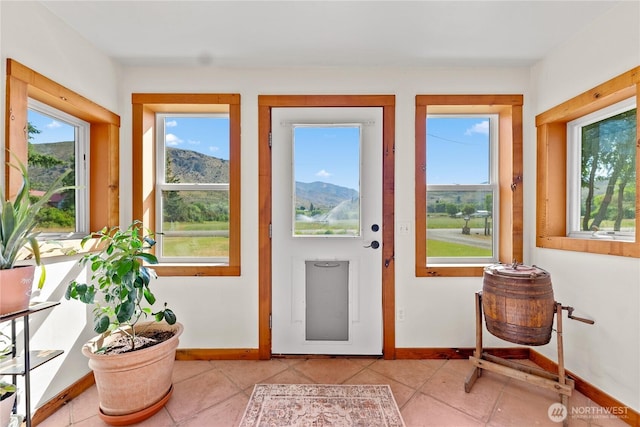 50 Lower Bear Creek Rd, Winthrop, WA 98862 - doorway to outside with plenty of natural light, light tile patterned floors, and a mountain view