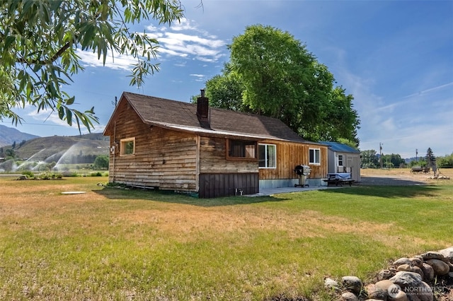 50 Lower Bear Creek Rd, Winthrop, WA 98862 - rear view of property with a lawn and a mountain view
