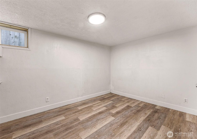 309 Bennett St, Sedro Woolley, WA 98284 - empty room featuring wood finished floors and a textured ceiling