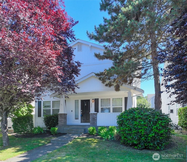 2237 Tolmie St, Dupont, WA 98327 - view of front of home with a porch and a front yard