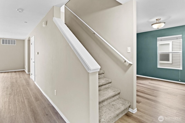 2237 Tolmie St, Dupont, WA 98327 - staircase featuring wood finished floors and baseboards
