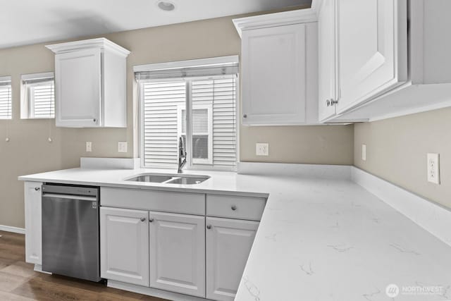 2237 Tolmie St, Dupont, WA 98327 - kitchen with dishwasher, white cabinetry, light countertops, and dark wood-style flooring