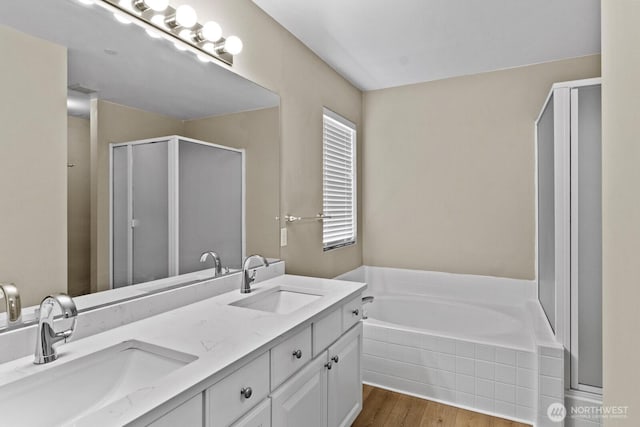 2237 Tolmie St, Dupont, WA 98327 - full bath featuring a shower stall, a bath, wood finished floors, and double vanity