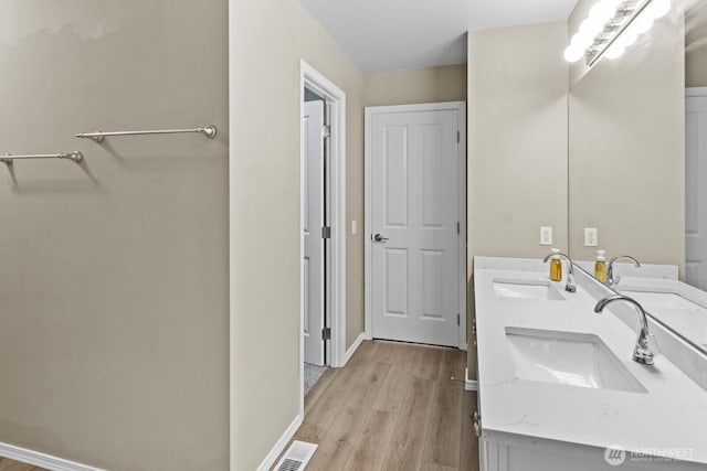 2237 Tolmie St, Dupont, WA 98327 - bathroom featuring wood finished floors and double vanity