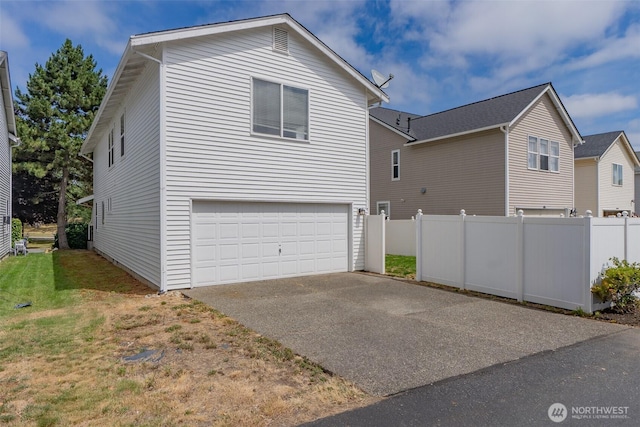 2237 Tolmie St, Dupont, WA 98327 - view of front of house featuring an attached garage and asphalt driveway