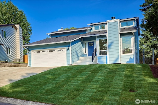 27409 146th Ave SE, Kent, WA 98042 - view of front of property featuring driveway, a garage, a chimney, and roof with shingles