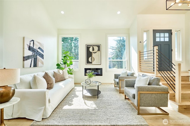 27409 146th Ave SE, Kent, WA 98042 - living room featuring stairs, wood finished floors, recessed lighting, and a glass covered fireplace
