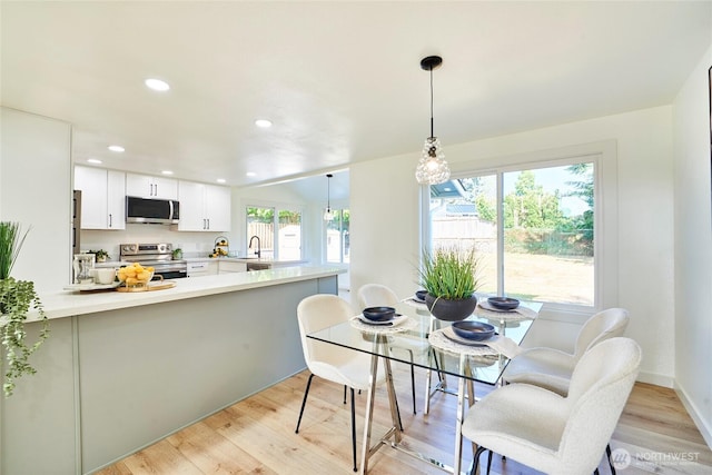 27409 146th Ave SE, Kent, WA 98042 - dining space with light wood-style flooring and recessed lighting