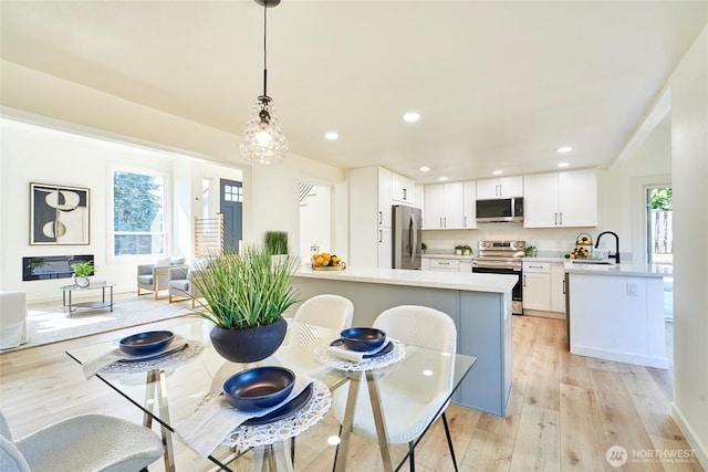 27409 146th Ave SE, Kent, WA 98042 - dining space with light wood-style floors and recessed lighting
