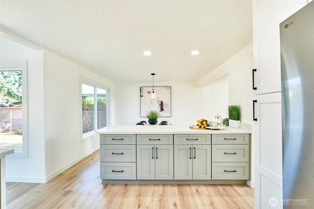 27409 146th Ave SE, Kent, WA 98042 - bar with freestanding refrigerator, light wood-style floors, recessed lighting, and hanging light fixtures