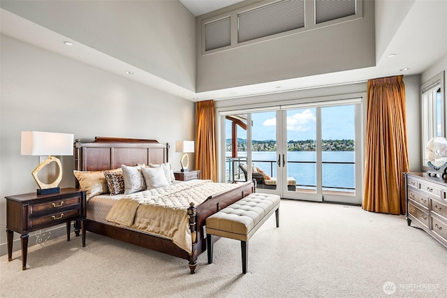 8440 Benotho Pl, Mercer Island, WA 98040 - bedroom featuring light carpet, access to outside, a water view, a high ceiling, and recessed lighting