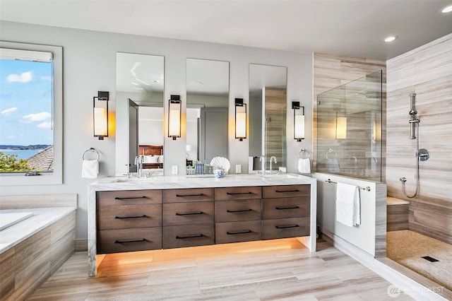 8440 Benotho Pl, Mercer Island, WA 98040 - bathroom with walk in shower, double vanity, a bath, and recessed lighting
