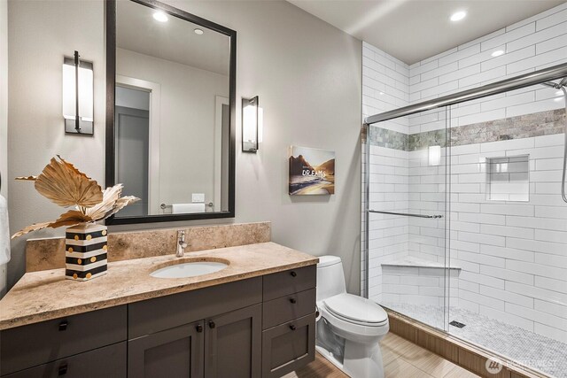 8440 Benotho Pl, Mercer Island, WA 98040 - full bath with a stall shower, vanity, recessed lighting, and wood finished floors