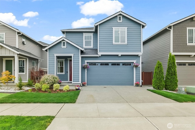 9018 Viola St SE, Tumwater, WA 98501 - traditional-style house featuring concrete driveway and a garage
