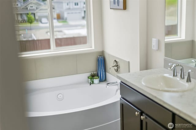 9018 Viola St SE, Tumwater, WA 98501 - bathroom featuring vanity and a garden tub