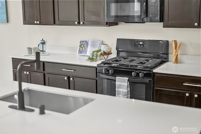 9018 Viola St SE, Tumwater, WA 98501 - kitchen with black appliances, light countertops, and dark brown cabinetry