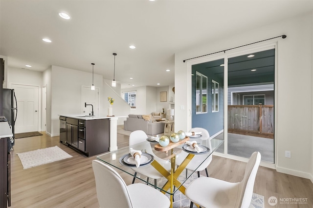 9018 Viola St SE, Tumwater, WA 98501 - dining room with light wood-style flooring and recessed lighting