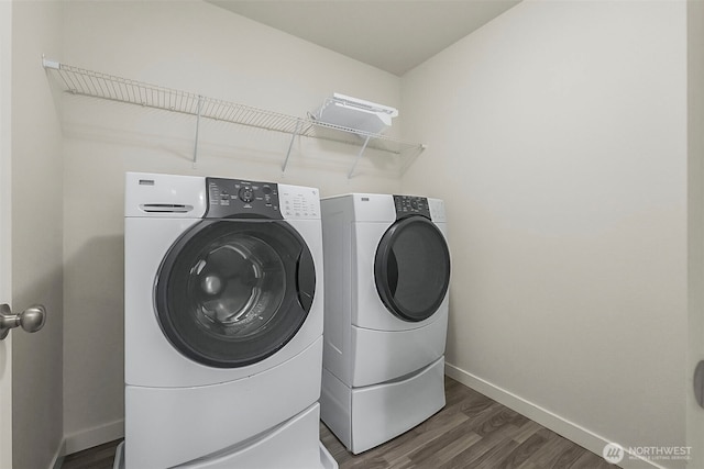 9018 Viola St SE, Tumwater, WA 98501 - washroom with independent washer and dryer and dark wood-style flooring