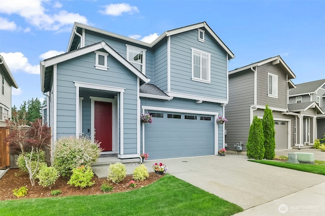 9018 Viola St SE, Tumwater, WA 98501 - traditional home with a garage and concrete driveway