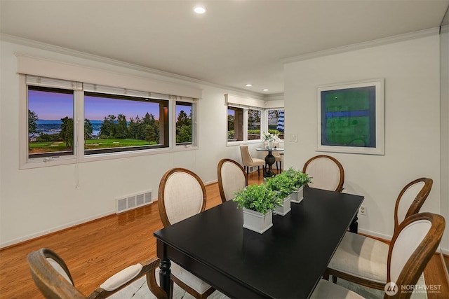 7761 Lakemont Dr NE, Seattle, WA 98115 - dining area with crown molding, recessed lighting, and wood finished floors