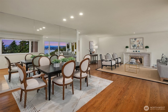 7761 Lakemont Dr NE, Seattle, WA 98115 - dining area featuring light wood-style floors, recessed lighting, and a high end fireplace