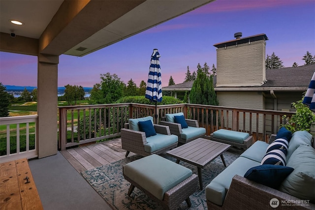 7761 Lakemont Dr NE, Seattle, WA 98115 - deck at dusk with outdoor lounge area