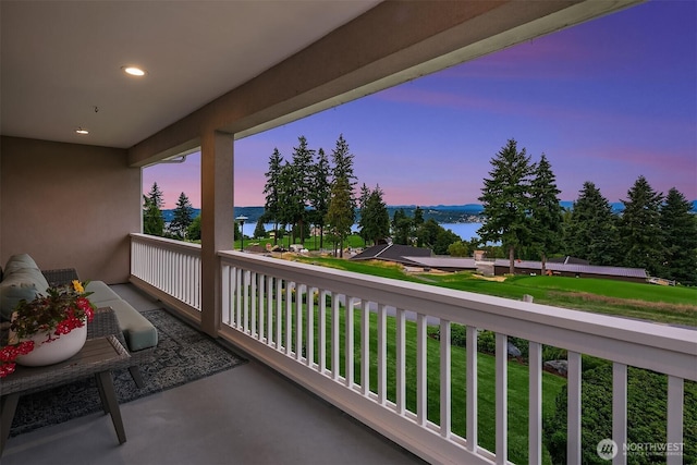 7761 Lakemont Dr NE, Seattle, WA 98115 - balcony at dusk featuring a water view