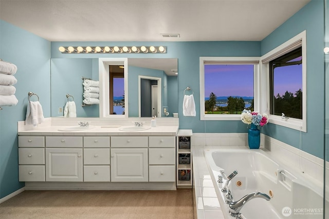 7761 Lakemont Dr NE, Seattle, WA 98115 - bathroom featuring double vanity and a jetted tub