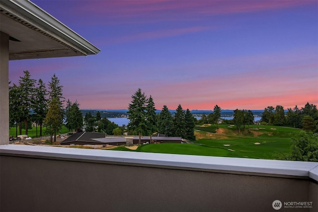 7761 Lakemont Dr NE, Seattle, WA 98115 - balcony at dusk featuring a water view