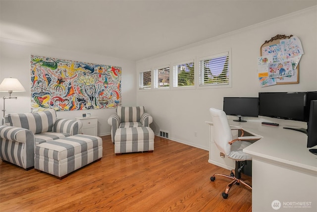 7761 Lakemont Dr NE, Seattle, WA 98115 - home office featuring light wood finished floors and crown molding