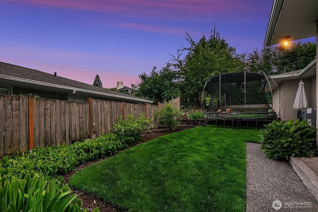 7761 Lakemont Dr NE, Seattle, WA 98115 - fenced backyard featuring a trampoline