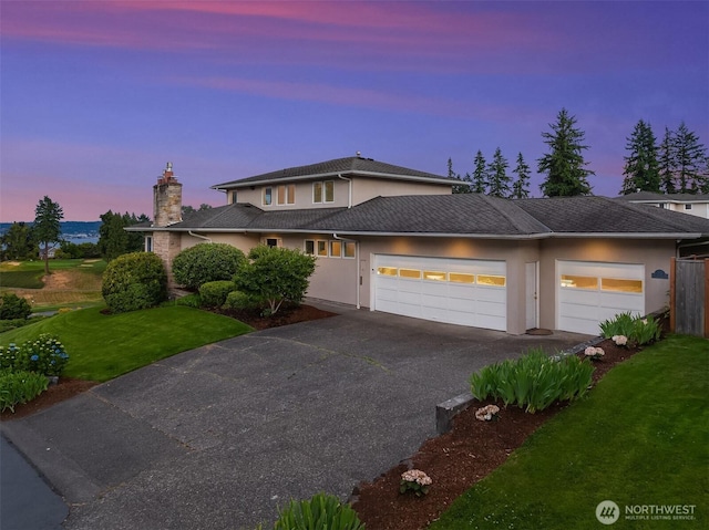 7761 Lakemont Dr NE, Seattle, WA 98115 - view of front of property featuring driveway, a garage, a front lawn, and stucco siding
