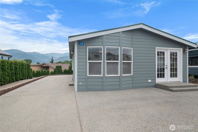 1000 State Route 150 Unit 18, Manson, WA 98831 - back of house featuring a patio, a mountain view, and french doors
