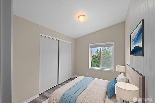 1000 State Route 150 Unit 18, Manson, WA 98831 - bedroom featuring wood finished floors, a closet, and vaulted ceiling