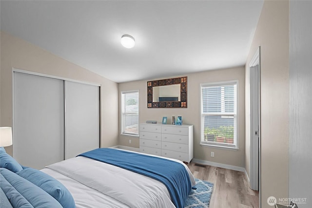 1000 State Route 150 Unit 18, Manson, WA 98831 - bedroom featuring light wood-style flooring, a closet, and lofted ceiling
