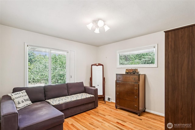 5325 Monta Vista Dr E, Edgewood, WA 98372 - living area with healthy amount of natural light and light wood-type flooring