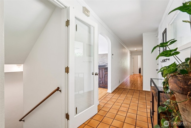 5325 Monta Vista Dr E, Edgewood, WA 98372 - corridor with light tile patterned floors, crown molding, and arched walkways