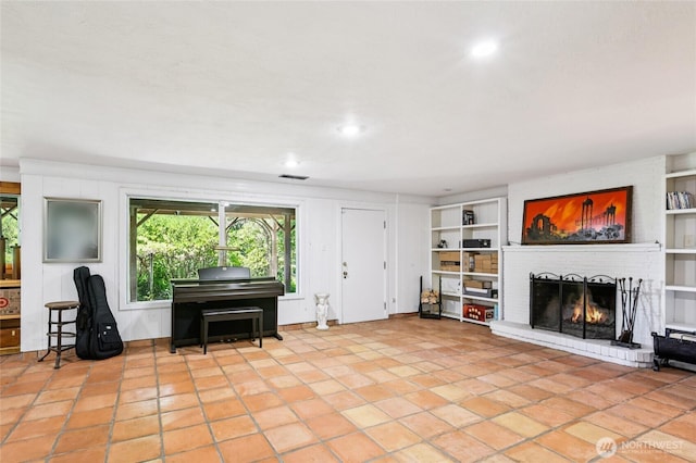 5325 Monta Vista Dr E, Edgewood, WA 98372 - living room featuring built in features, a brick fireplace, and recessed lighting