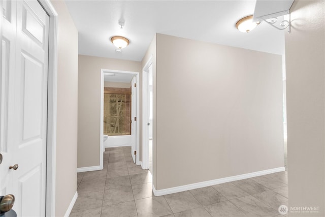1628 118th Ave SE Unit F316, Bellevue, WA 98005 - corridor with light tile patterned floors and baseboards