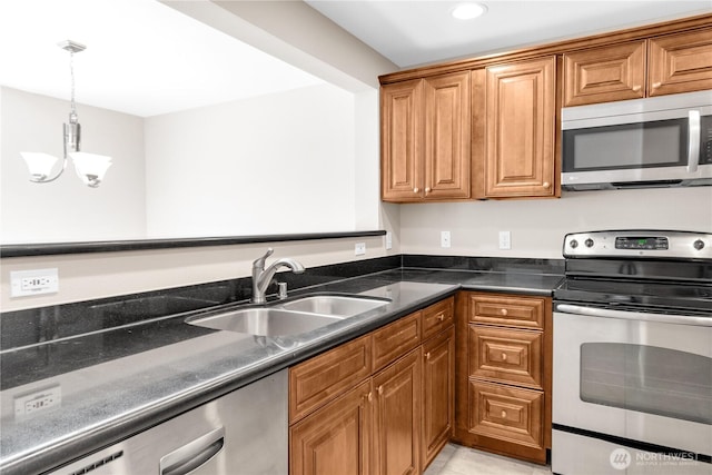 1628 118th Ave SE Unit F316, Bellevue, WA 98005 - kitchen featuring appliances with stainless steel finishes, a chandelier, brown cabinets, and recessed lighting