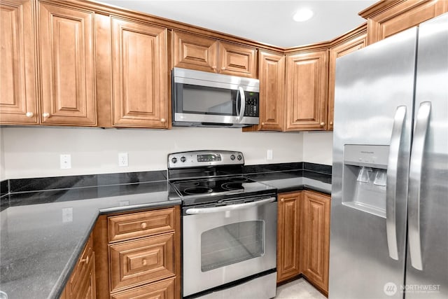 1628 118th Ave SE Unit F316, Bellevue, WA 98005 - kitchen with stainless steel appliances and brown cabinetry
