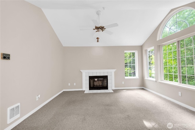 1628 118th Ave SE Unit F316, Bellevue, WA 98005 - unfurnished living room with vaulted ceiling, ceiling fan, carpet flooring, and a tile fireplace