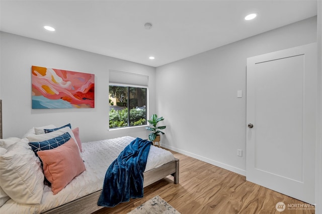 11701 100th Ave NE Unit 2, Kirkland, WA 98034 - bedroom with wood finished floors and recessed lighting