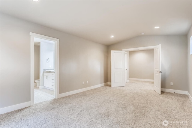 411 205th St SW Unit A, Lynnwood, WA 98036 - spare room featuring light colored carpet, lofted ceiling, and recessed lighting