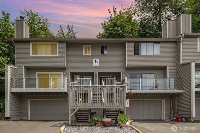 31308 107th Pl SE Unit B1, Auburn, WA 98092 - view of front facade with a garage, a chimney, driveway, and stairs
