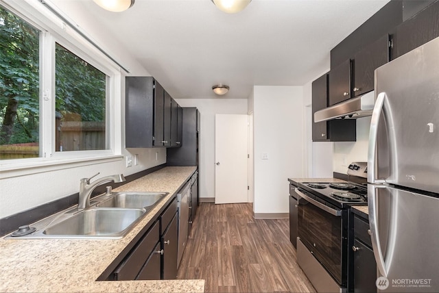 31308 107th Pl SE Unit B1, Auburn, WA 98092 - kitchen with stainless steel appliances, under cabinet range hood, dark wood-style floors, and light countertops
